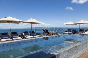 Outdoor pool, open 9:00 AM to 9:00 PM, sun loungers