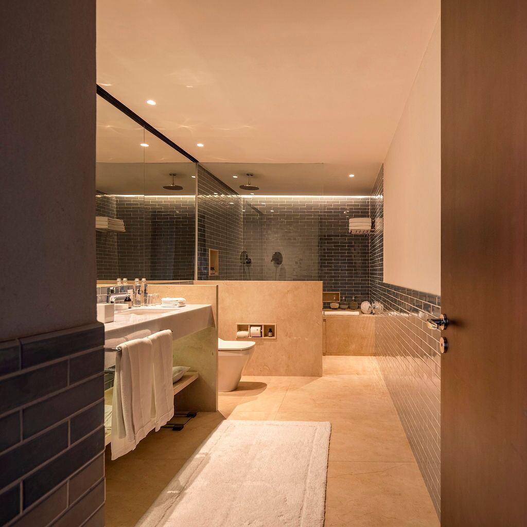 deluxe suite, oceanfront | bathroom | separate bathtub and shower, rainfall showerhead, hair dryer, slippers