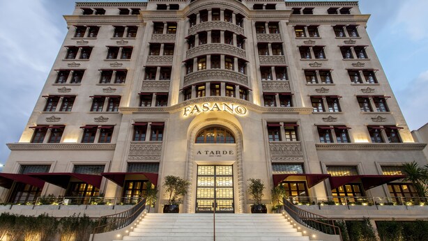 A grand building with a prominent entrance labeled "FASANO A TARDÉ" and multiple floors with large windows. - Hotel Fasano Salvador (Salvador)