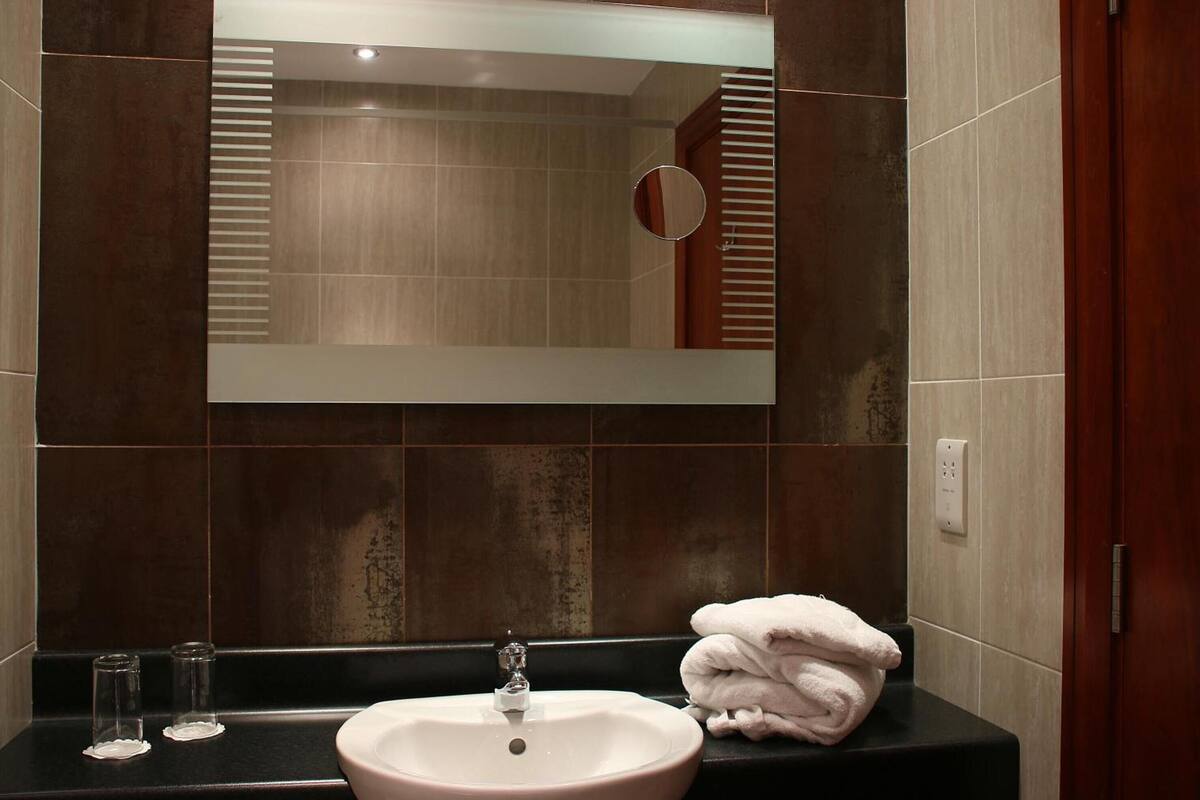 combined shower/bathtub, hair dryer, towels, soap