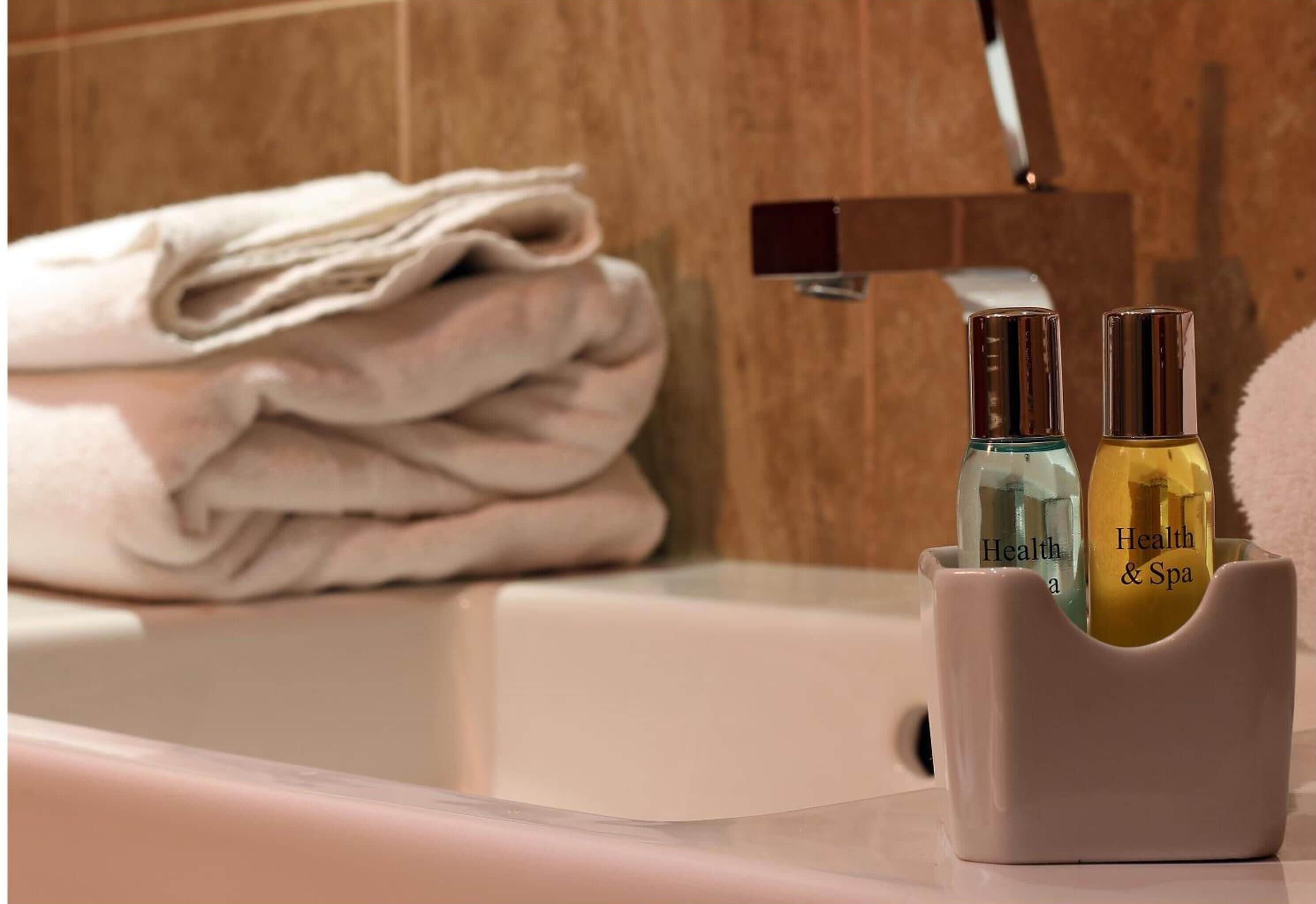 combined shower/bathtub, hair dryer, towels, soap