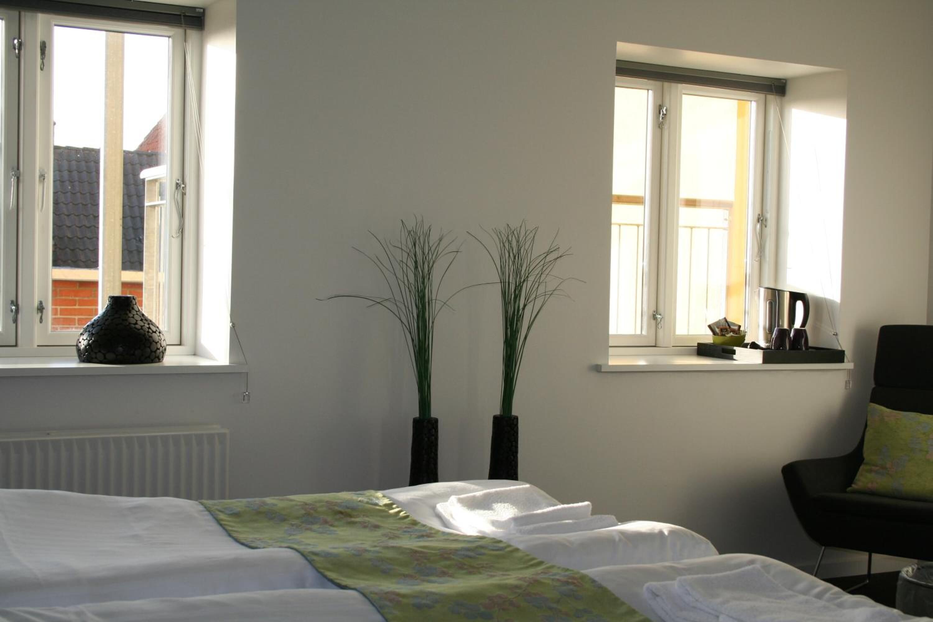 premium bedding, iron/ironing board, free wifi, bed sheets