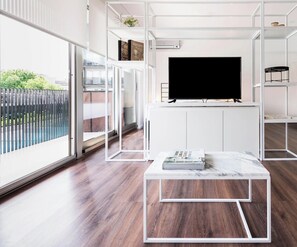 Studio | Living area | 40-inch LCD TV with cable channels, TV, pay movies