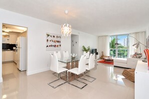 A modern apartment with a dining area, kitchen, and living space. - Ocean front condo on Hollywood Beach !!! 1 bedroom / 3rd floor (Hollywood)