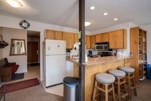 Fridge, oven, stovetop, coffee/tea maker - SE048 | Slopeside Condo | Mountain Views | Hot Tub | Winter Shuttle (Steamboat Springs)