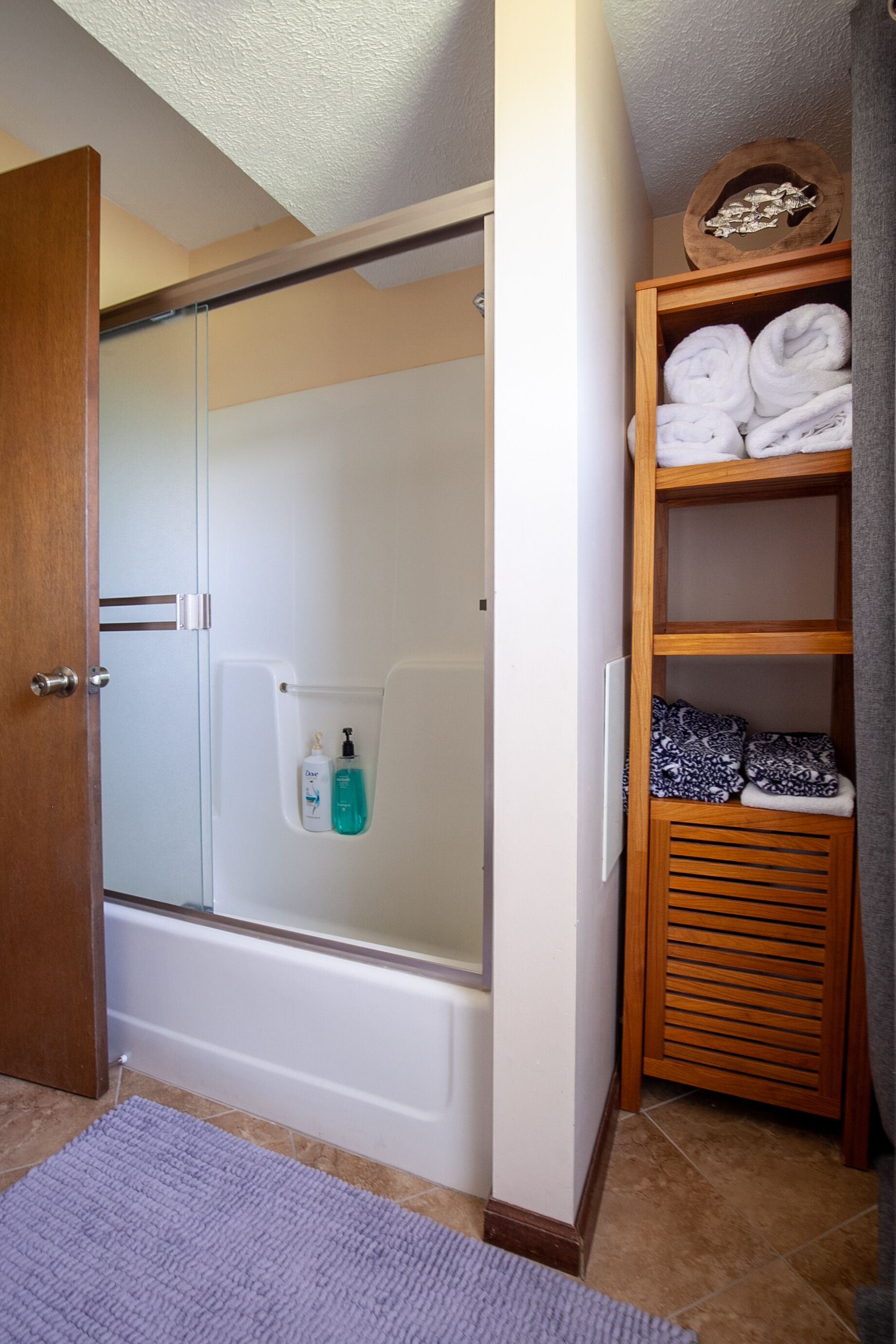 Combined shower/tub, hair dryer, towels, soap
