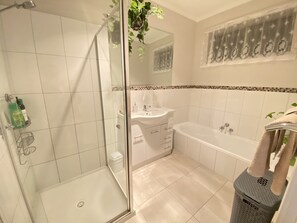 Bathtub, hair dryer, towels, soap