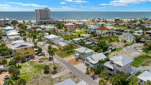 A coastal residential area with houses, a beach, and a large hotel. - Private Pool- North Island Home- 4BR Island Pearl (Fort Myers Beach)