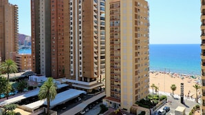 A high-rise hotel with multiple balconies overlooking a beach. - Baccana 9-4 (Benidorm)