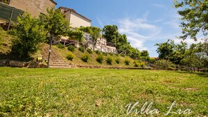 A grassy area with a staircase leading up to a building. - Private House with Exclusive Swimming Pool Heated and Amazing View (Boccheggiano)