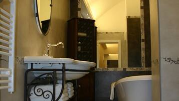 Combined shower/tub, hair dryer, towels, soap