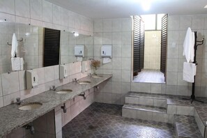 Duplex, 1 Queen Bed, Non Smoking | Bathroom | Shower, hair dryer, towels