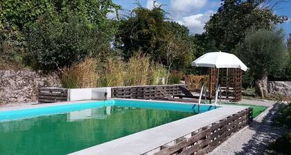Countryside house with garden and natural pool.