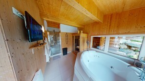 Een douche, een bubbelbad, een haardroger, een bidet