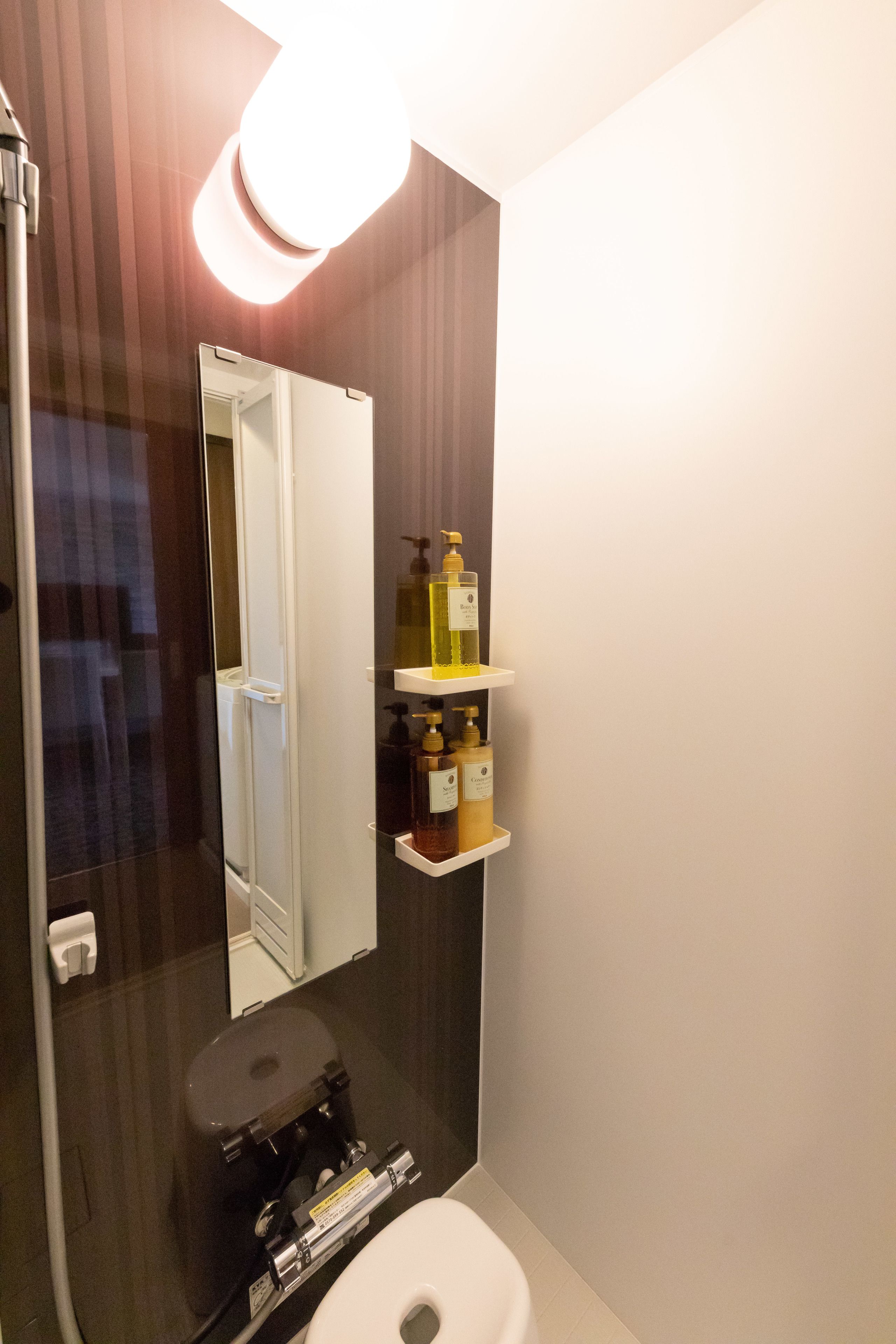 separate bathtub and shower, hair dryer, slippers, towels