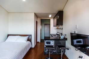 Standard Double Room | Living area | 32-inch LCD TV with cable channels, TV