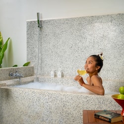 Designer toiletries, hair dryer, bathrobes, slippers