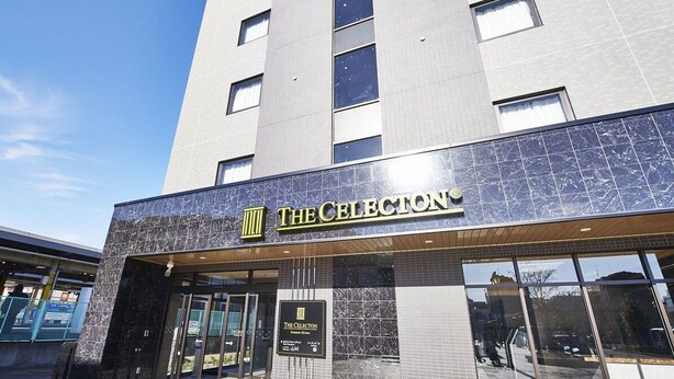 A modern building with a sign reading "The Collection."