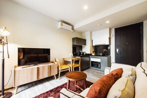 Standard Apartment, 1 Bedroom | Living area | Flat-screen TV