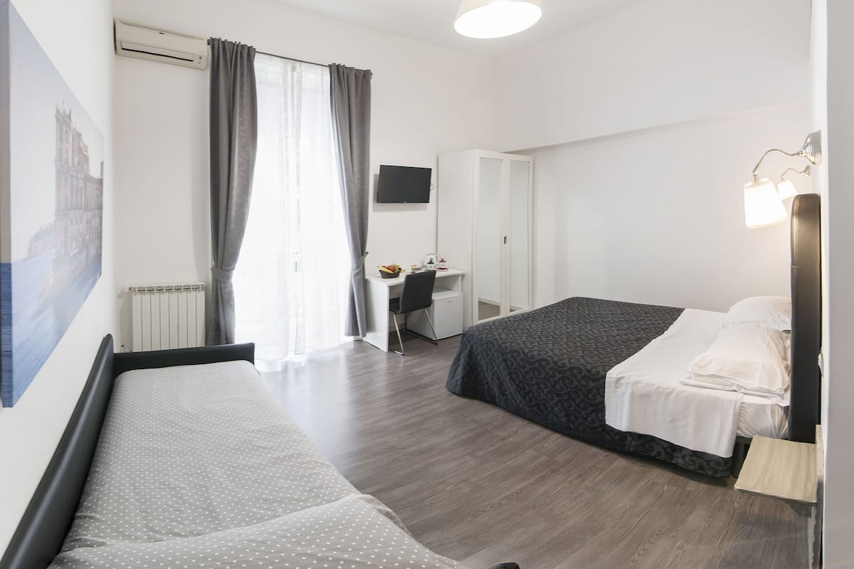 Comfort Quadruple Room, City View | Premium bedding, minibar, in-room safe, desk