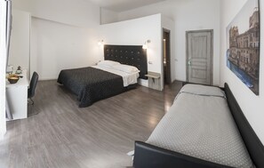 A modern hotel room with a large bed, a smaller bed, a desk with a chair, and a painting on the wall. - B&B Solimena (Naples)