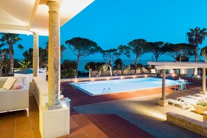 Seasonal outdoor pool, pool umbrellas, pool loungers