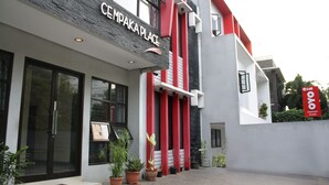 A modern building with a sign reading "CEMPAKA PLACE". - Hotel O Cempaka Place Homestay (Jakarta)