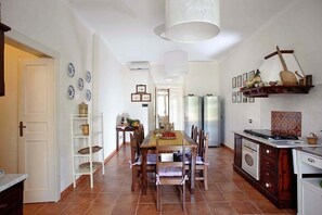 Enjoy cooking and dining in this well-equipped kitchen with a central island and dining area.