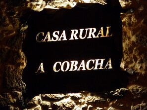 A sign with the text "CASA RURAL A COBACHA".