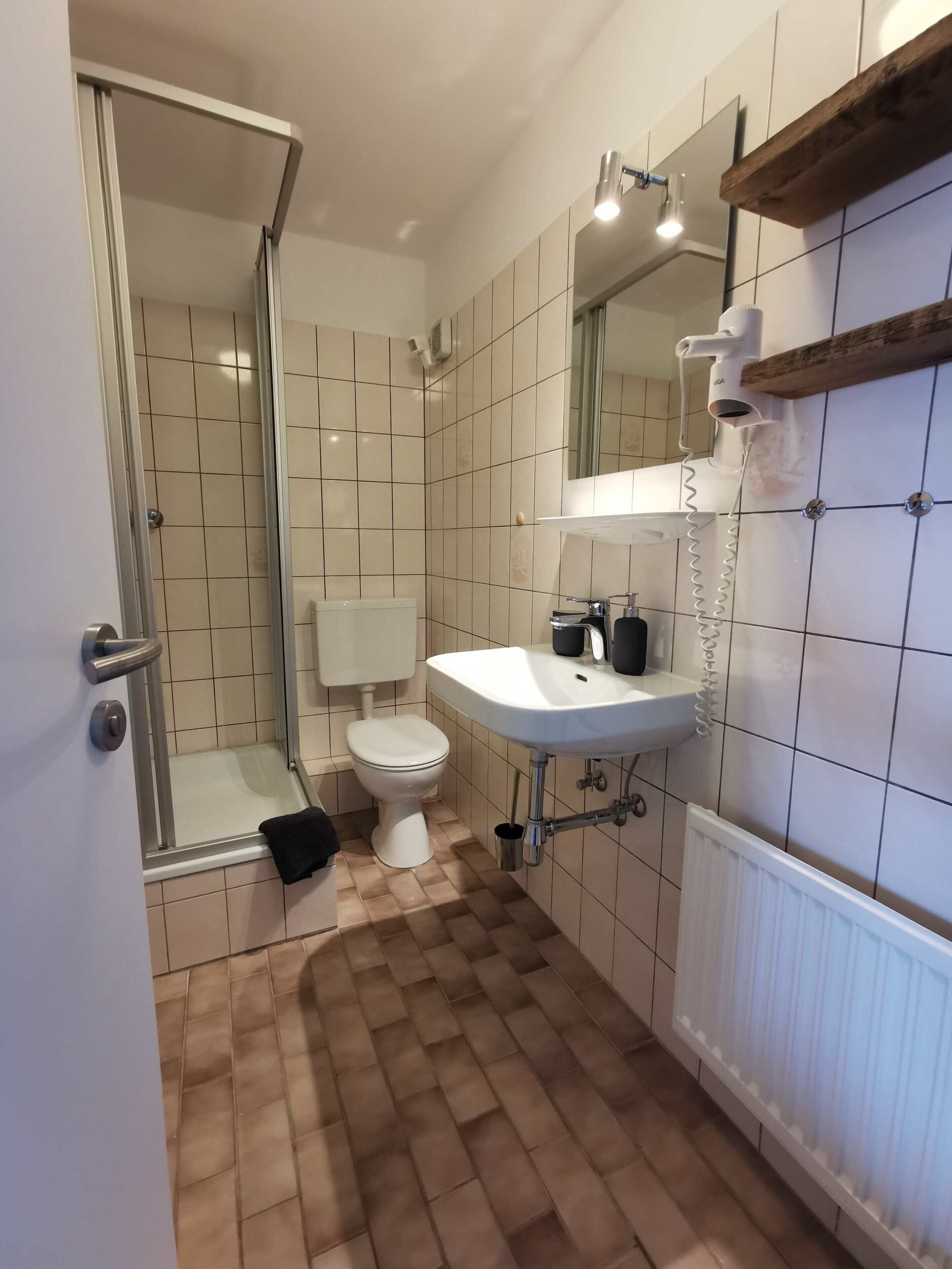 family room | bathroom | shower, hair dryer, towels