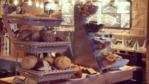 A buffet setup with multiple serving baskets filled with various breads and pastries. - Landgasthof Rebstock (Ottenhofen im Schwarzwald)