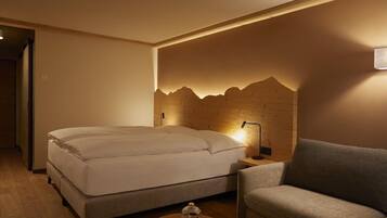Hypo-allergenic bedding, free minibar items, in-room safe, desk