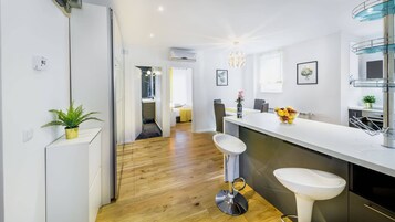 Superior Apartment, Private Bathroom, City View | Private kitchen | Fridge, microwave, stovetop, dishwasher