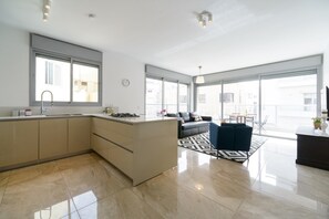 Apartment, 3 Bedrooms | Private kitchen | Full-size fridge, microwave, oven, stovetop - 3 BDR Balcony W Parking by Banana Beach (Tel Aviv)
