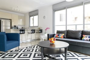 Apartment, 3 Bedrooms | Living room | Flat-screen TV - 3 BDR Balcony W Parking by Banana Beach (Tel Aviv)