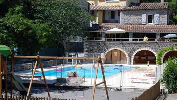 Seasonal outdoor pool, pool loungers