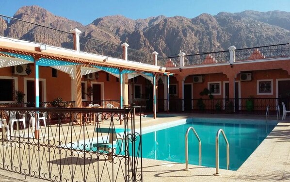 Outdoor pool, pool umbrellas, pool loungers