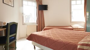 A bedroom with two beds, a desk, a chair, a television, and windows with curtains. - Chambres d'Hôtes du Colvert (Forges-les-Eaux)