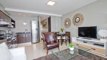 Family Apartment, 2 Bedrooms | Living area | Flat-screen TV
