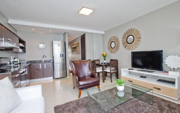 Family Apartment, 2 Bedrooms | Living area | Flat-screen TV - 401 Infinity Apartment (Cape Town)