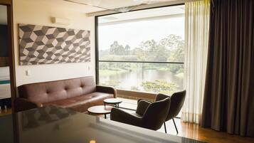 Suite, 1 King Bed with Sofa bed, Lake View | Living area