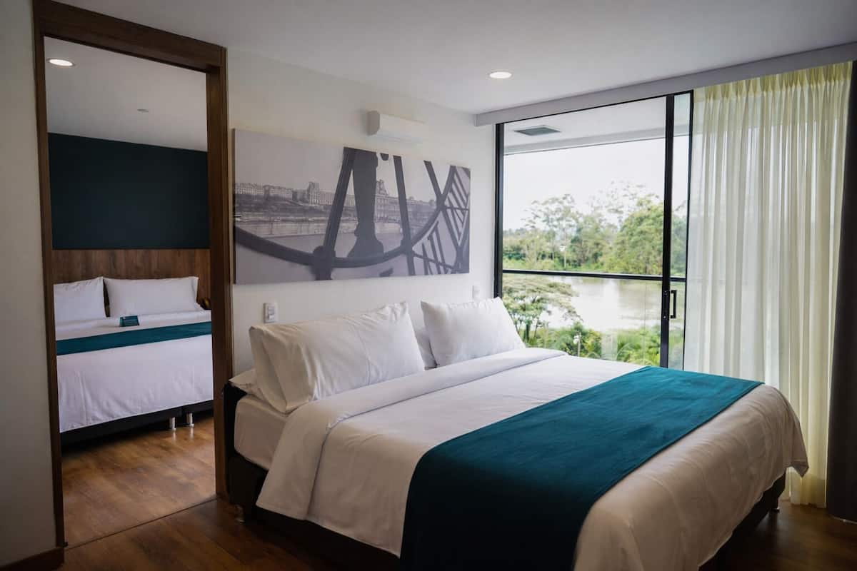 Family Quadruple Room, 2 Bathrooms | Down comforters, minibar, in-room safe, desk