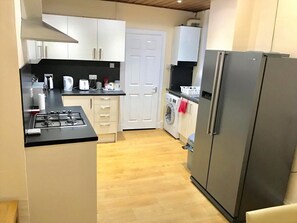 House, Multiple Beds, Non Smoking | Shared kitchen | Full-size fridge, microwave, oven, stovetop