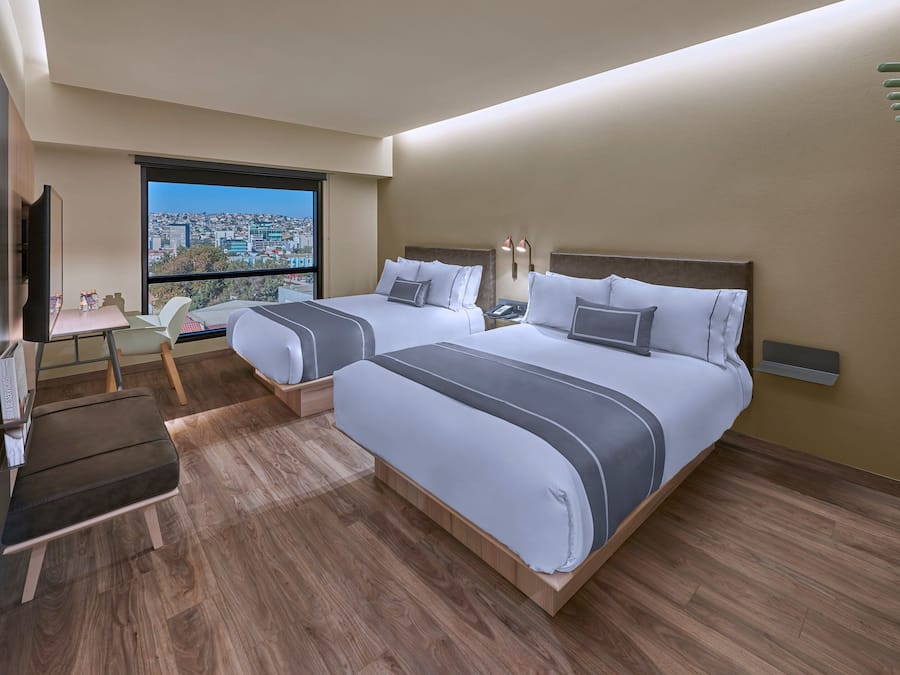 Room, 2 Double Beds | In-room safe, desk, iron/ironing board, free cribs/infant beds