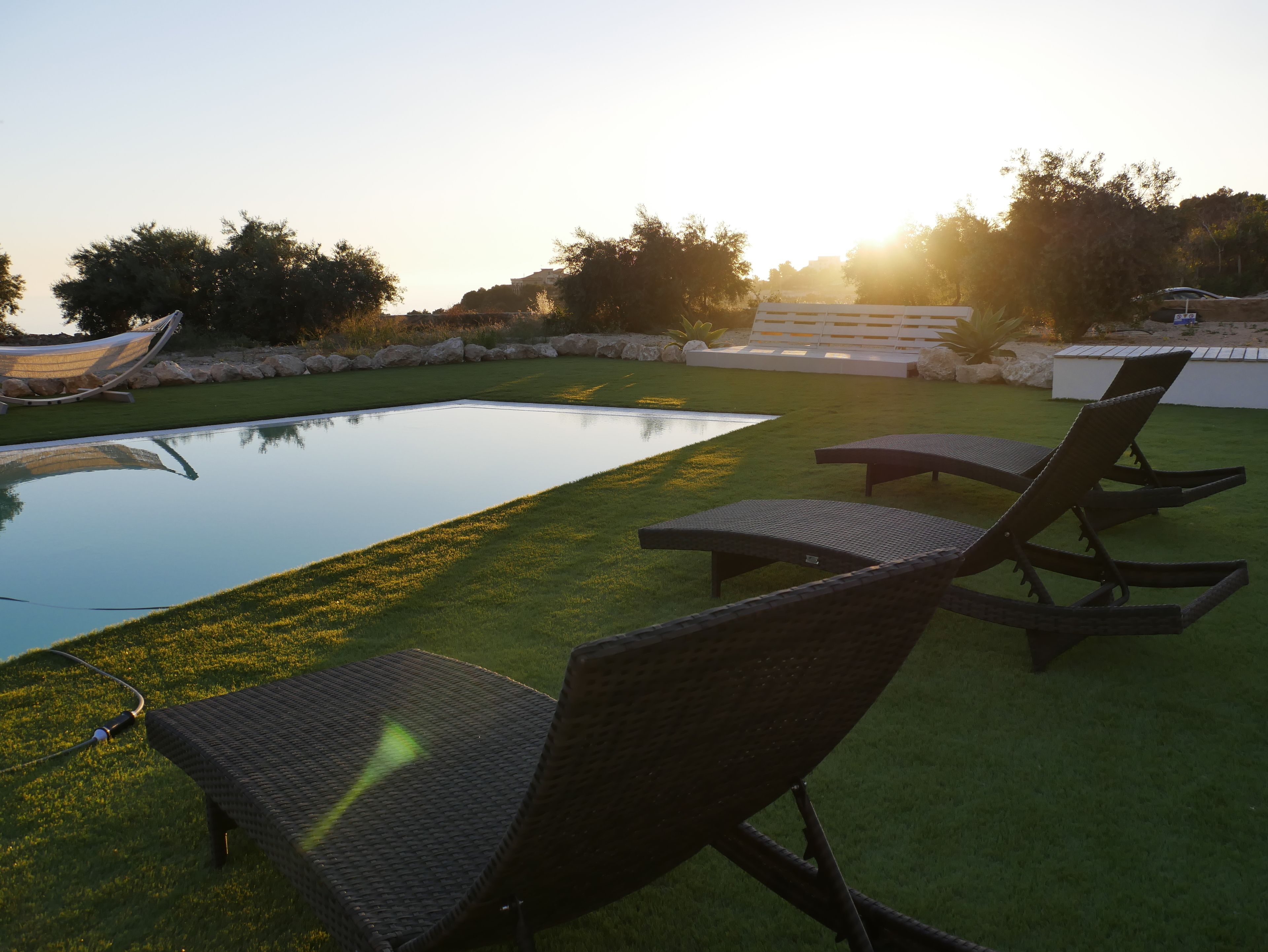 Seasonal outdoor pool, pool umbrellas, pool loungers