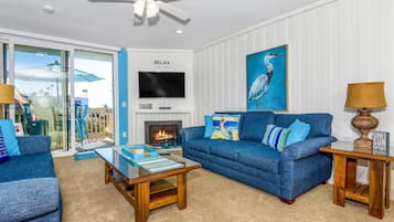 House, Multiple Beds (Sea Breeze Penthouse) | Living area | TV, fireplace, DVD player