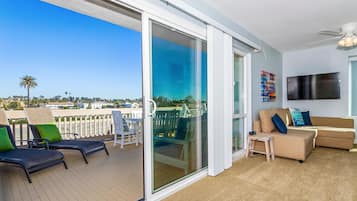 House, Multiple Beds (Sea Breeze Penthouse) | Living area | TV, fireplace, DVD player