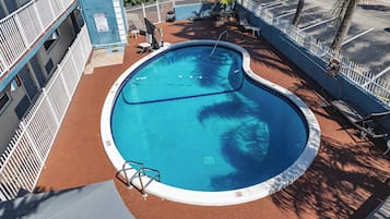 Outdoor pool, open 7:00 AM to 7:00 PM, pool loungers