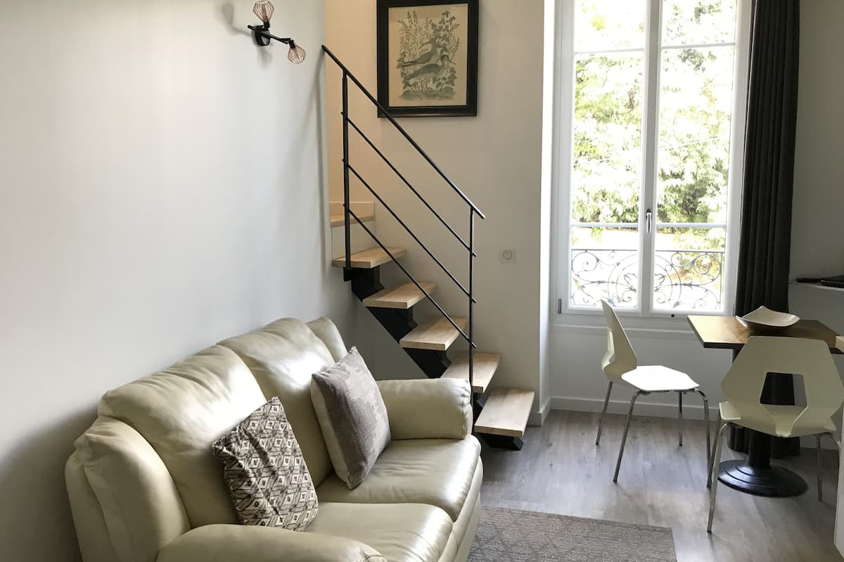 Classic Duplex, 1 Bedroom | Living area | Flat-screen TV, DVD player