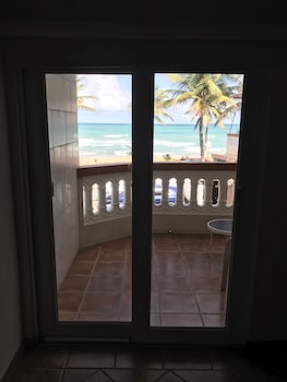 Room, 1 King Bed, Ocean View | Blackout drapes, iron/ironing board, free WiFi, bed sheets at Luquillo Sunrise beach Inn